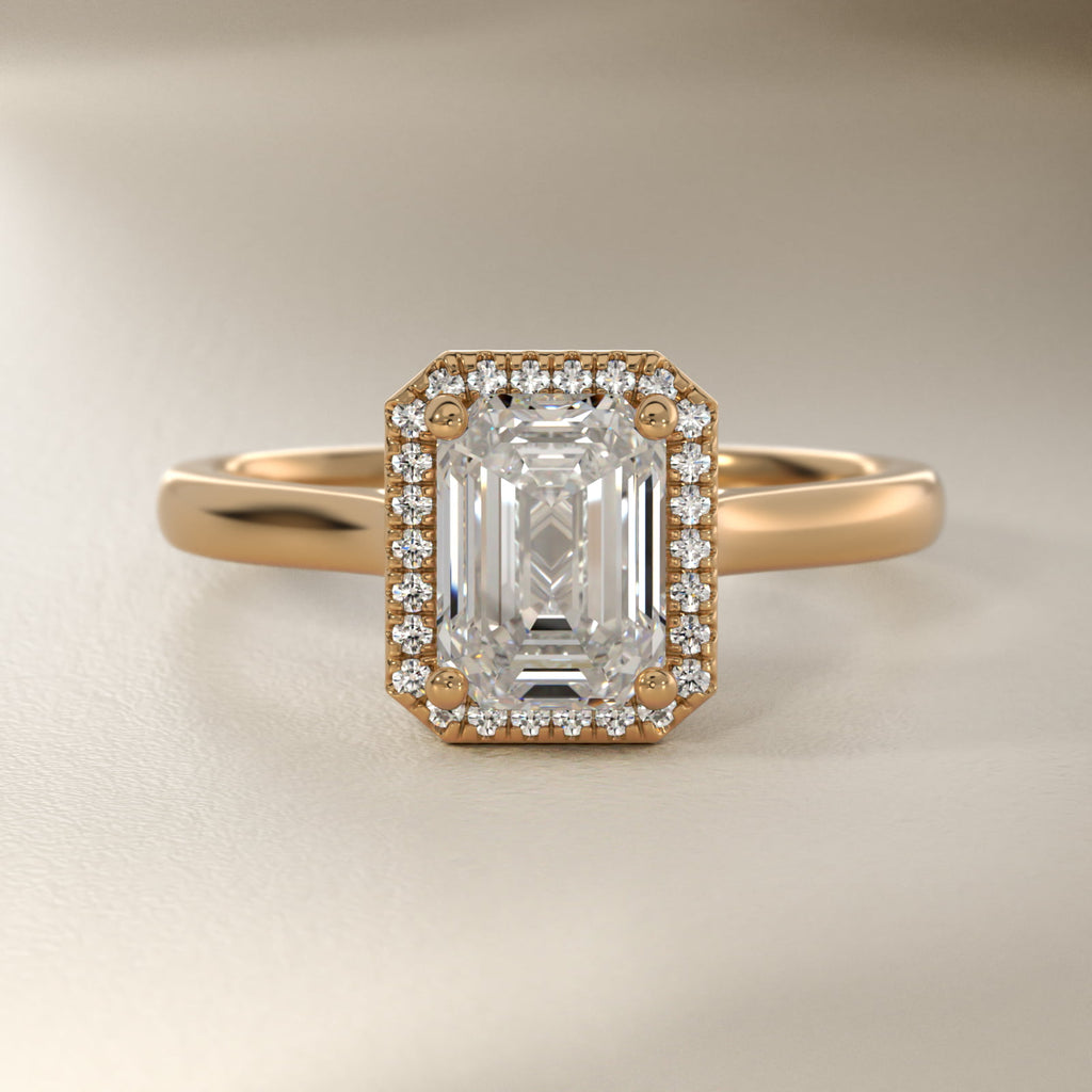 Anillo de compromiso halo corte esmeralda