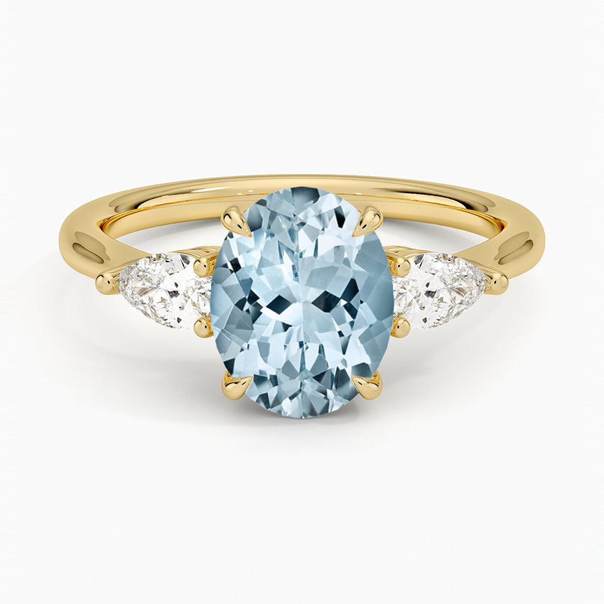 Anillo de compromiso aguamarina ovalada tres piedras