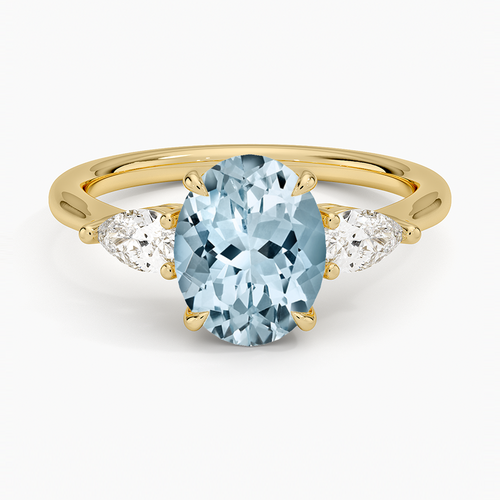 Anillo de compromiso tres piedras, forma oval, con aguamarina, en oro amarillo, Joyería Bruzzone