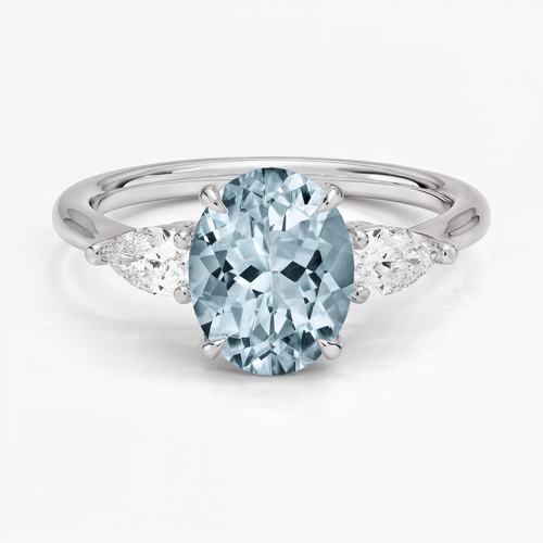 Anillo de compromiso tres piedras, forma oval, con aguamarina, en oro blanco, Joyería Bruzzone